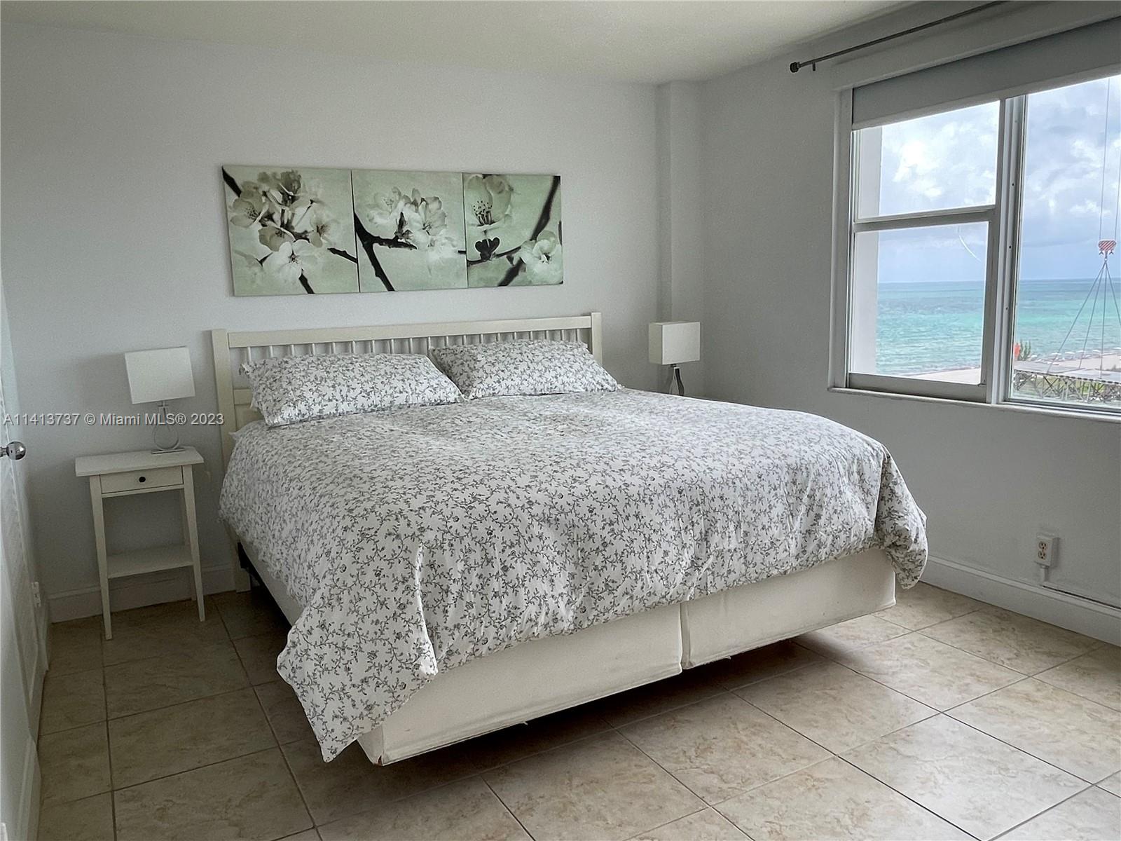 Surfside Surfside, FL 33154 - Photo 24 of 27 a bed sitting in a bedroom next to a window