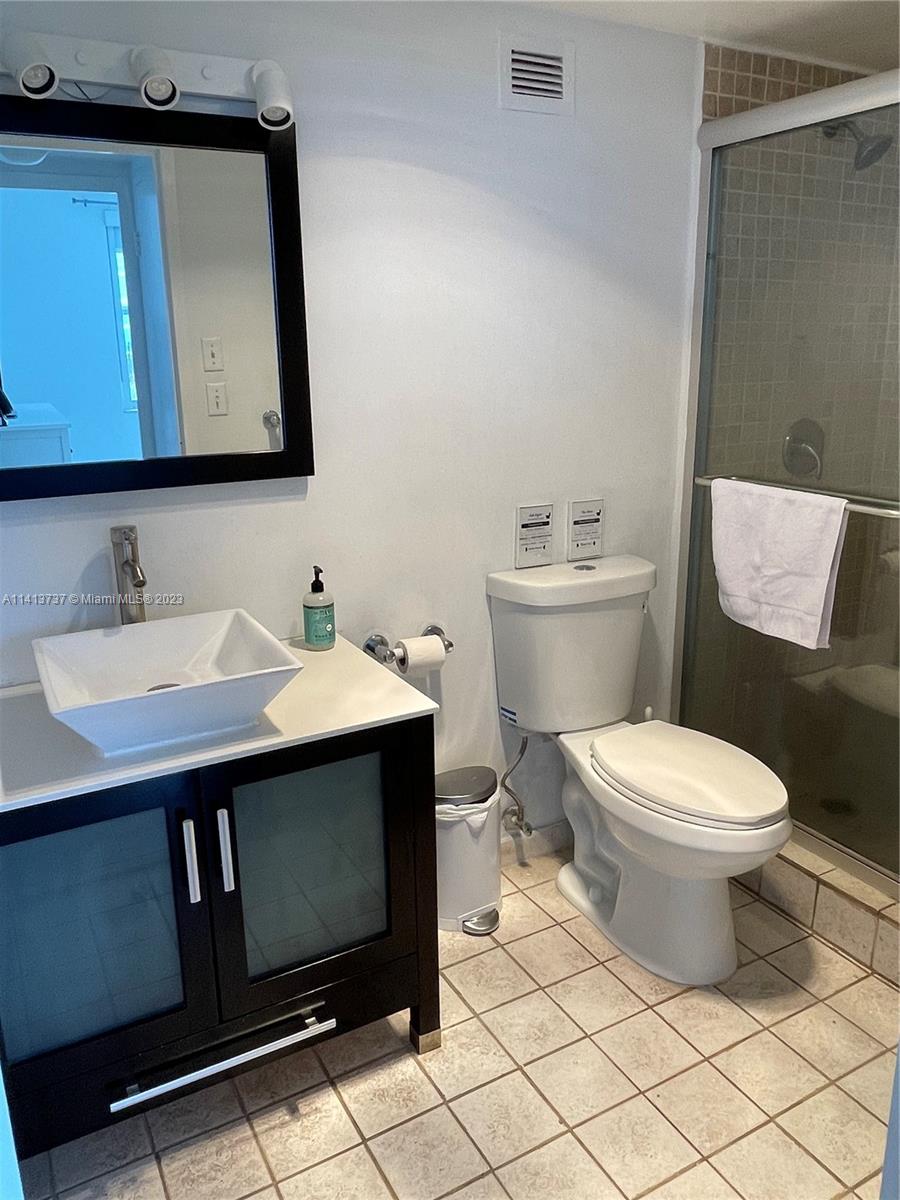 Surfside Surfside, FL 33154 - Photo 27 of 27 a bathroom with a sink toilet and mirror