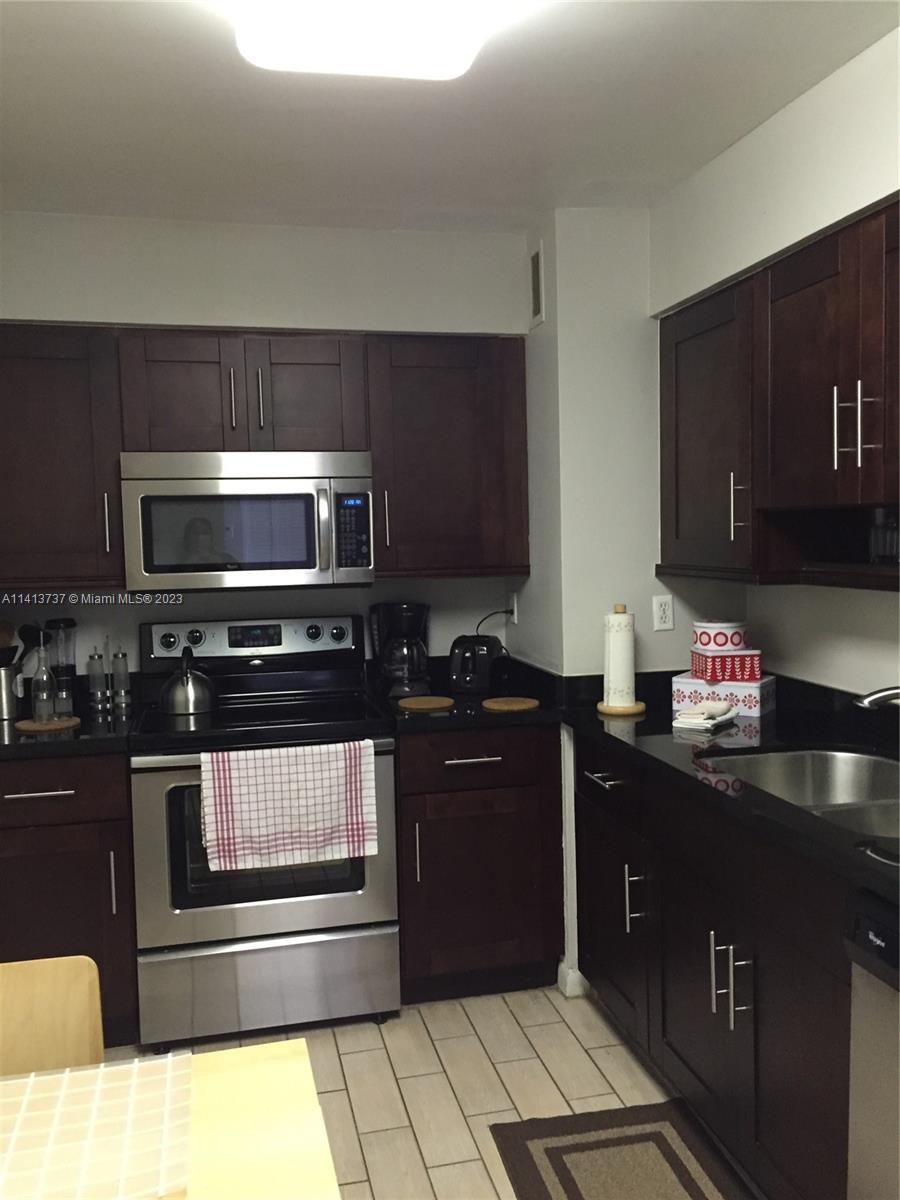 Surfside Surfside, FL 33154 - Photo 3 of 27 a kitchen with a sink and a microwave