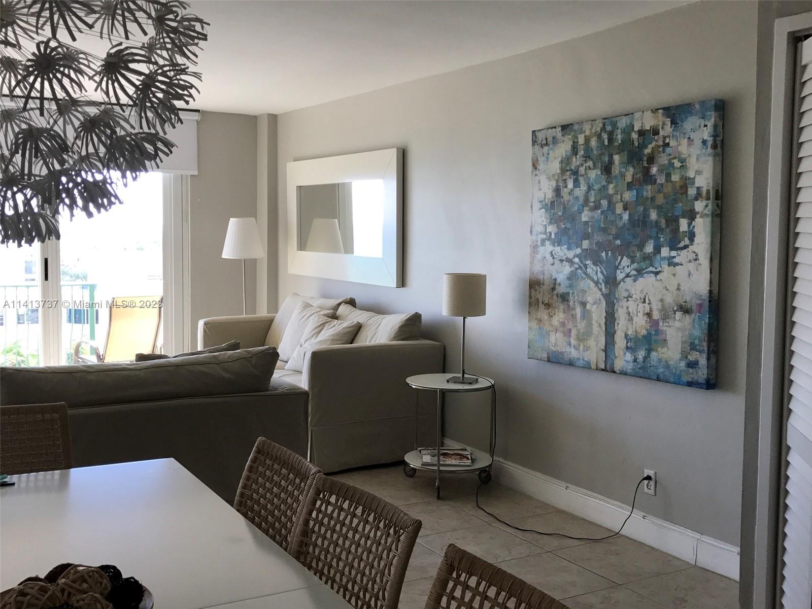 Surfside Surfside, FL 33154 - Photo 5 of 27 a living room with furniture and a floor to ceiling window