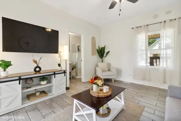 a living room with furniture and a flat screen tv