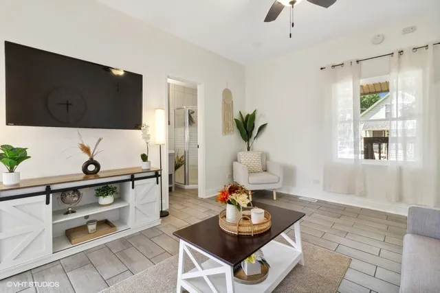 a living room with furniture and a flat screen tv