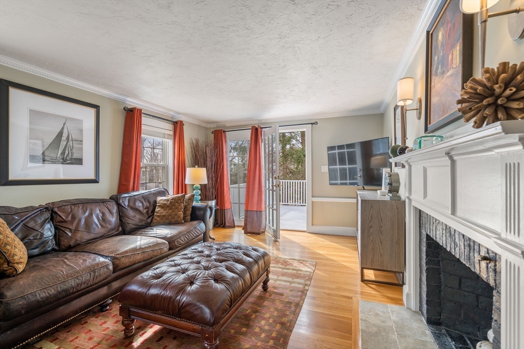 23 Hemlock Road Newton, MA 02464 - Photo 13 of 42 a living room with furniture and a fireplace