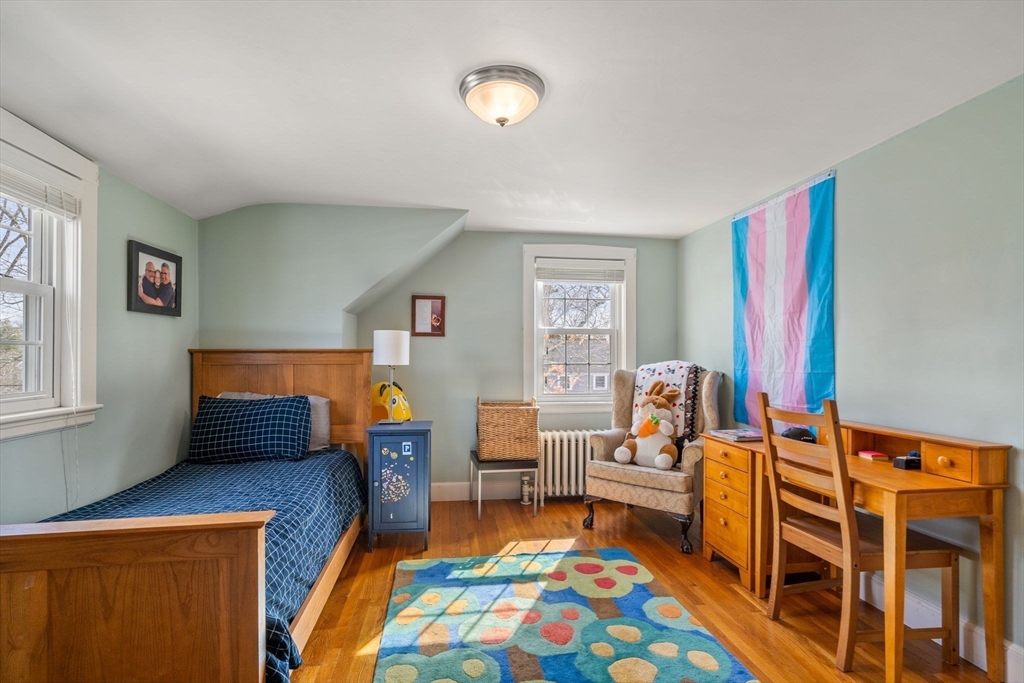 23 Hemlock Road Newton, MA 02464 - Photo 24 of 42 a bedroom with furniture and a wooden floor