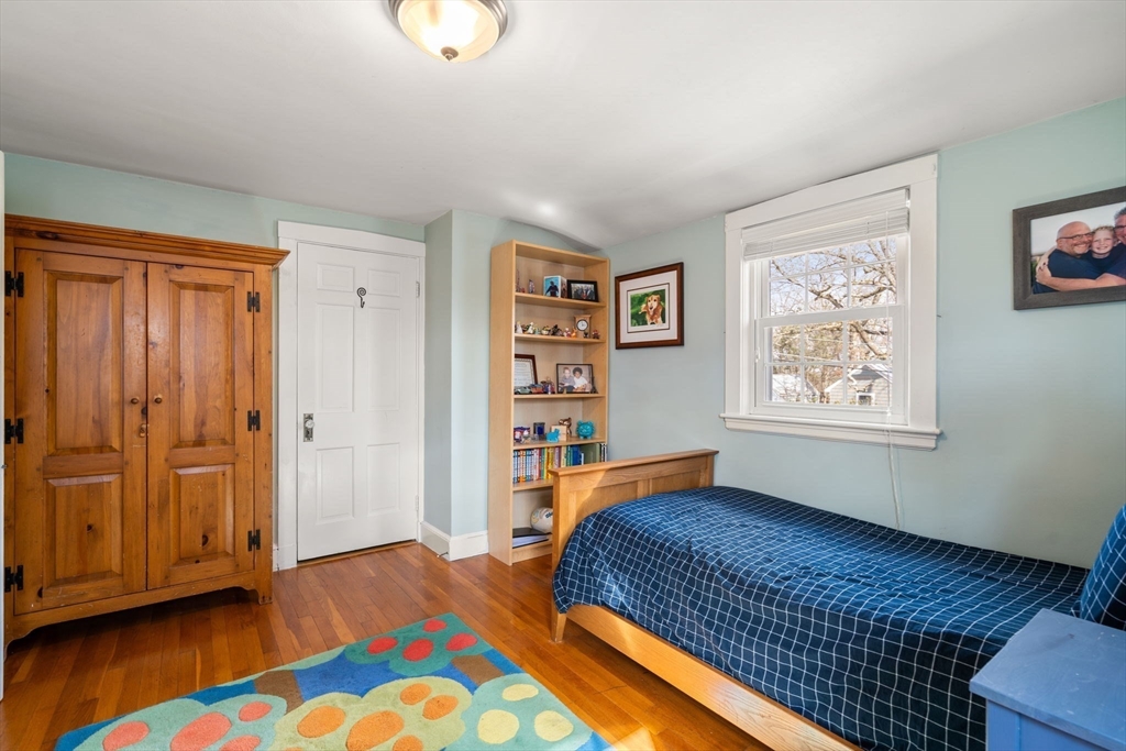 23 Hemlock Road Newton, MA 02464 - Photo 25 of 42 a bedroom with a bed and a window in it
