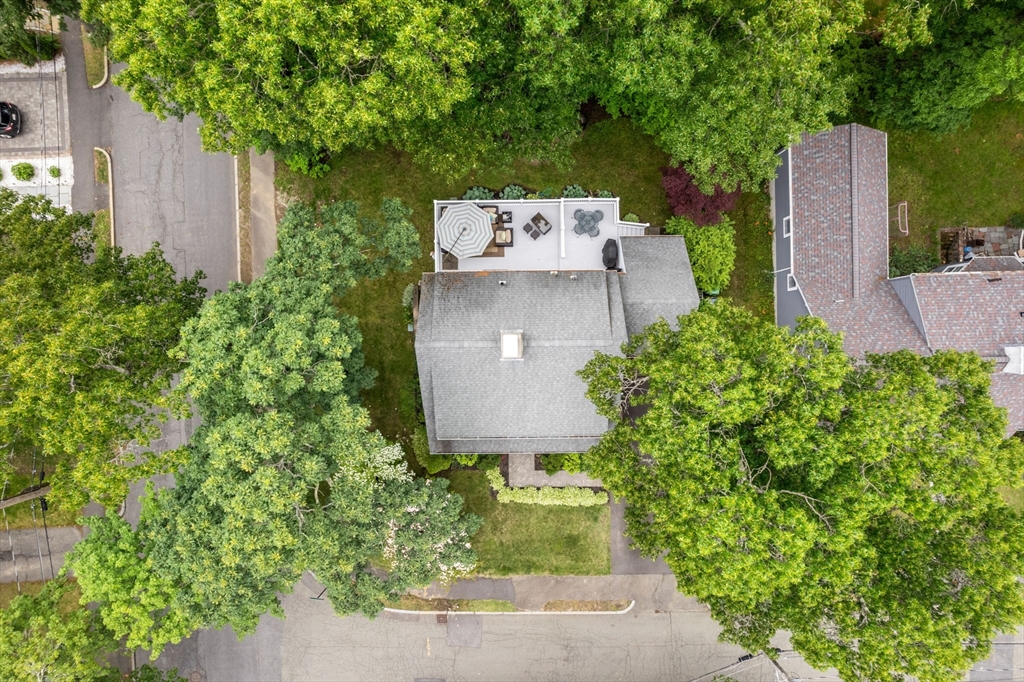 23 Hemlock Road Newton, MA 02464 - Photo 40 of 42 an aerial view of a house with a yard and large tree