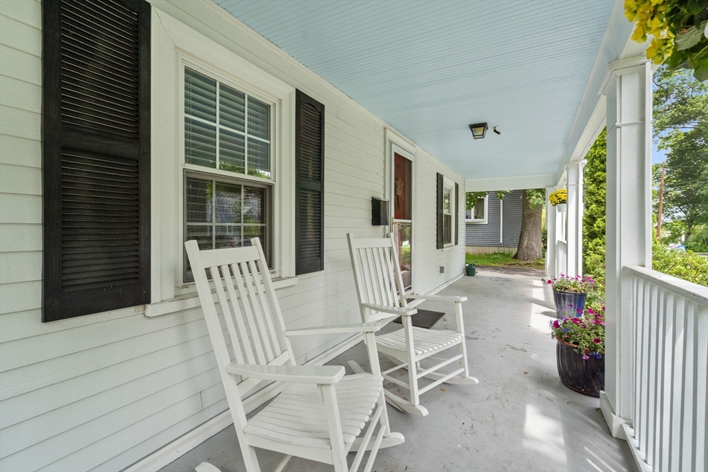 23 Hemlock Road Newton, MA 02464 - Photo 4 of 42 a view of a chairs and table in patio with a fireplace