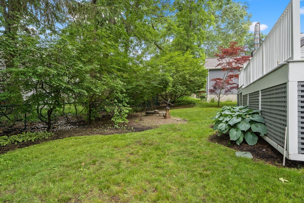 23 Hemlock Road Newton, MA 02464 - Photo 6 of 42 a backyard of a house with table and chairs