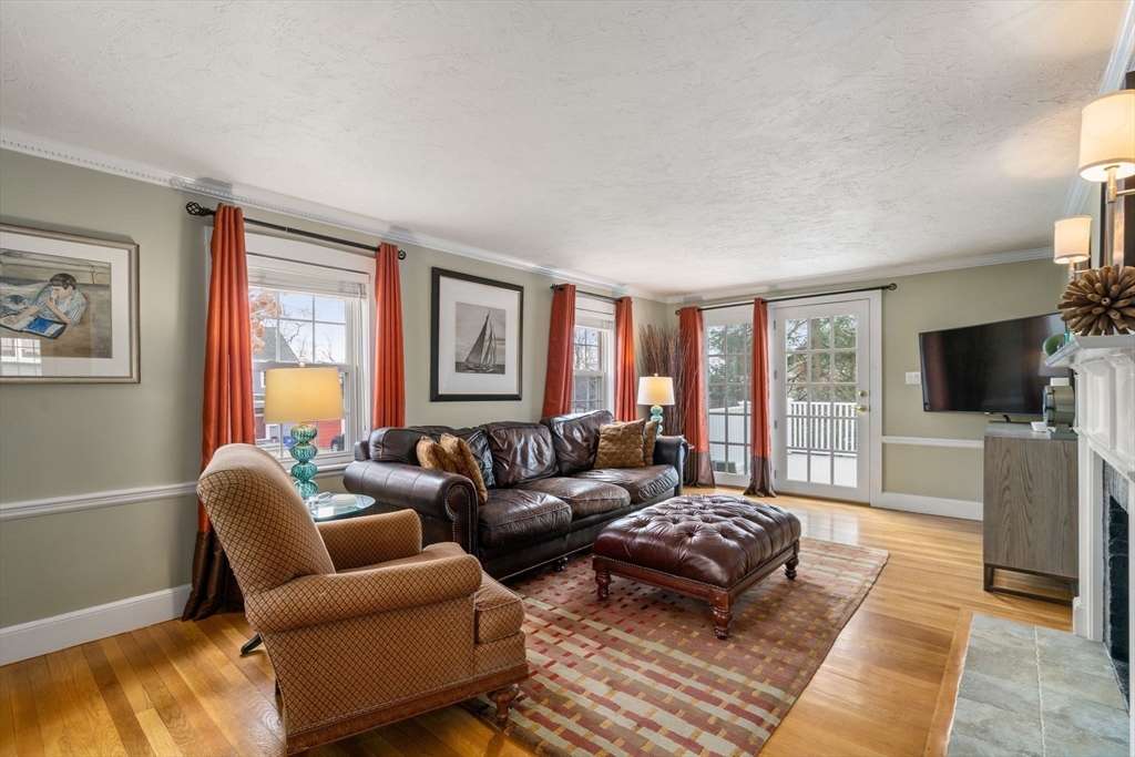 23 Hemlock Road Newton, MA 02464 - Photo 8 of 42 a living room with furniture and a flat screen tv