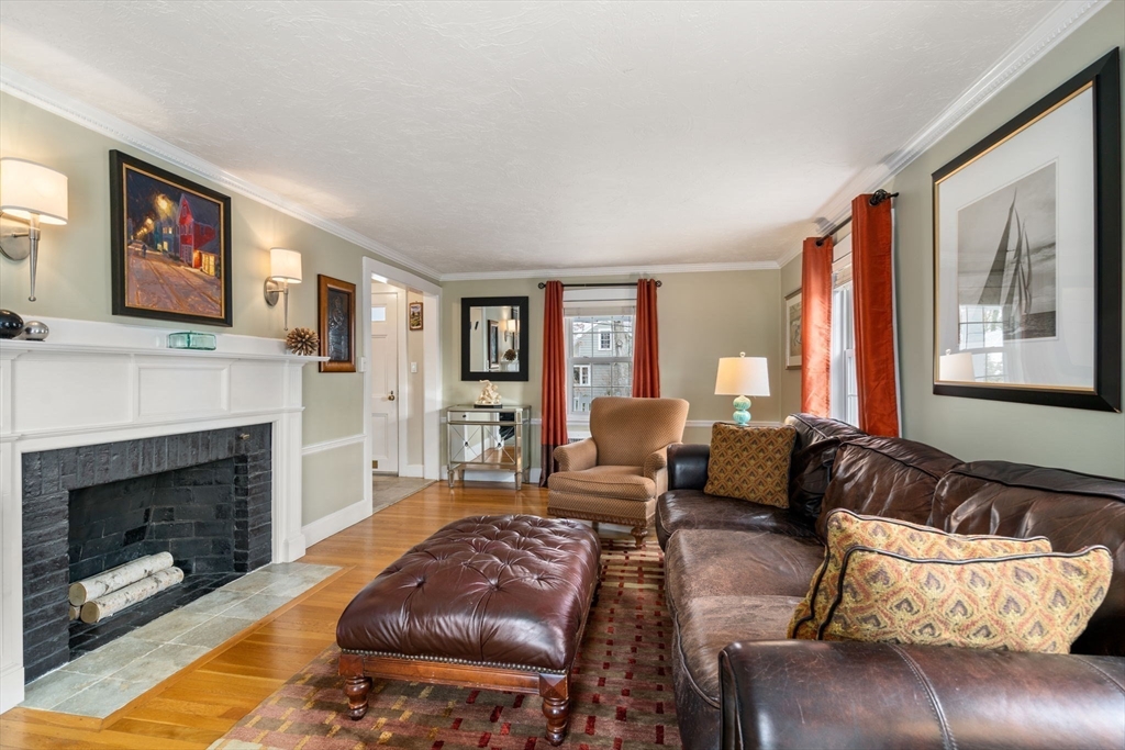 23 Hemlock Road Newton, MA 02464 - Photo 9 of 42 a living room with furniture and a fireplace