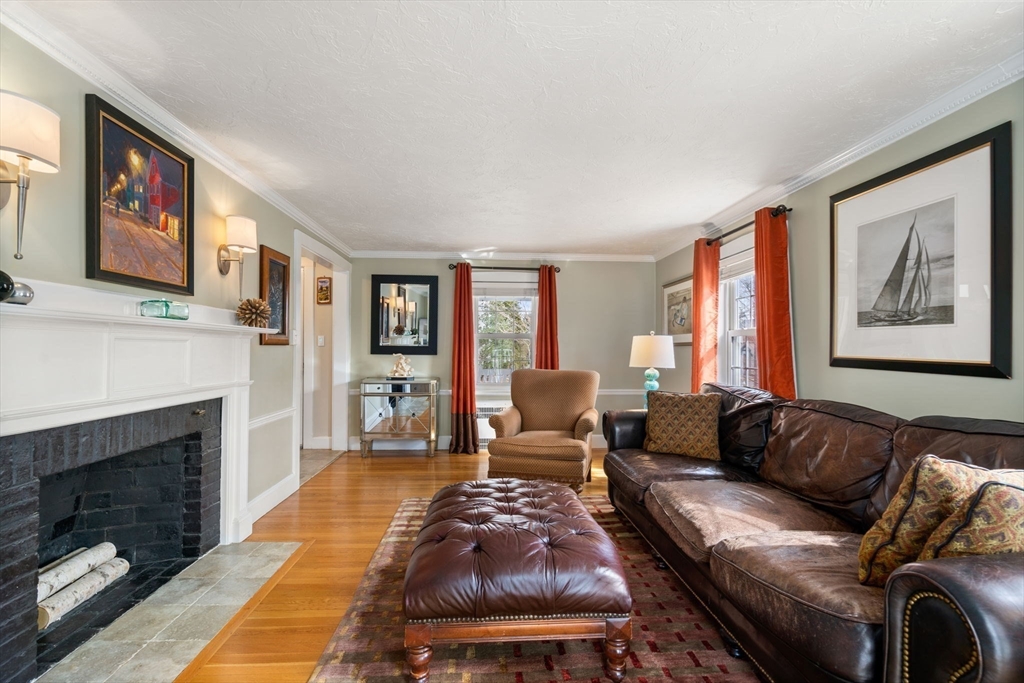 23 Hemlock Road Newton, MA 02464 - Photo 10 of 42 a living room with furniture and a fireplace