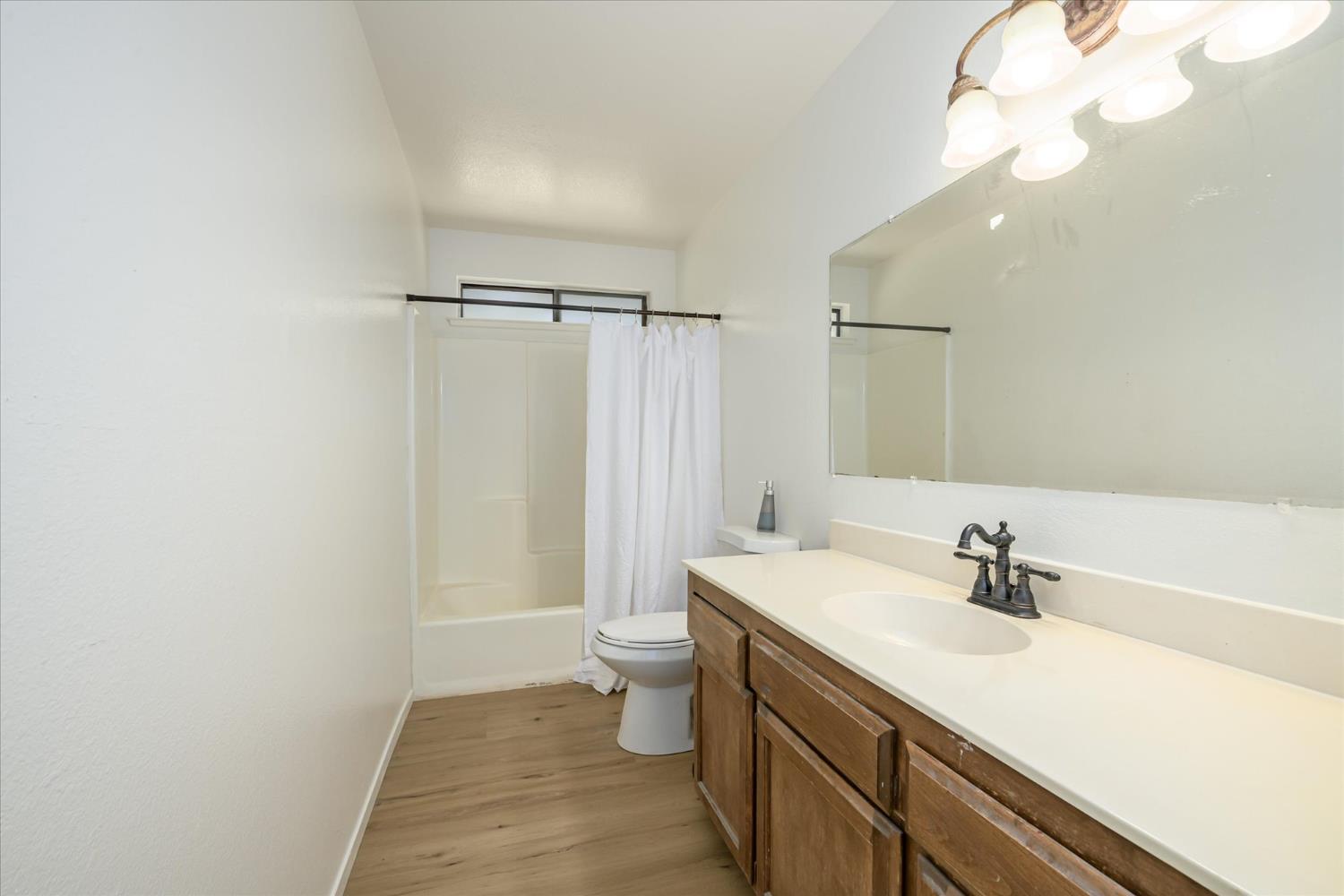 4910 Chisholm Trail Placerville, CA 95667 - Photo 18 of 41 a bathroom with a sink a toilet a mirror and shower