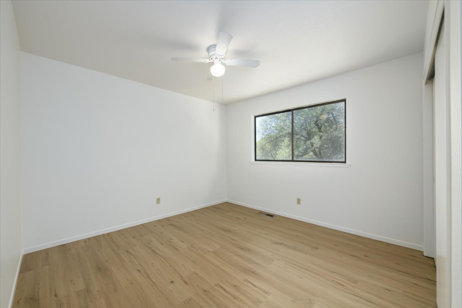4910 Chisholm Trail Placerville, CA 95667 - Photo 19 of 41 a view of empty room with wooden floor