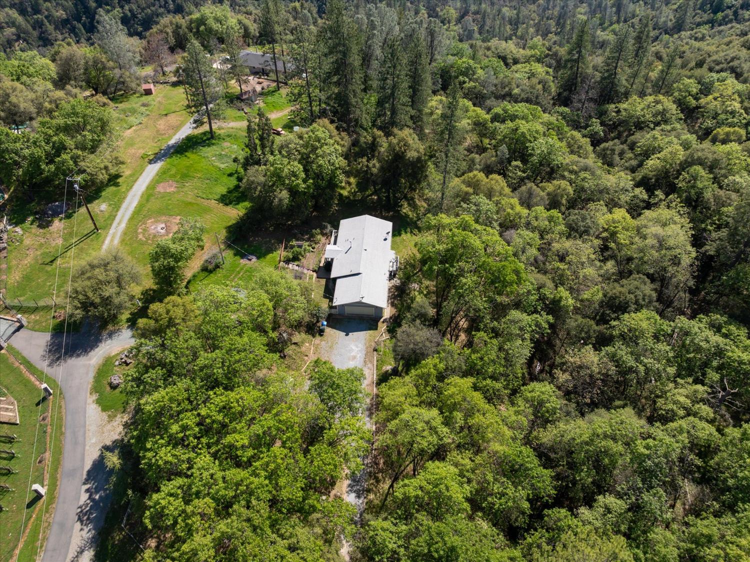 4910 Chisholm Trail Placerville, CA 95667 - Photo 31 of 41 an aerial view of a house with a yard and outdoor seating