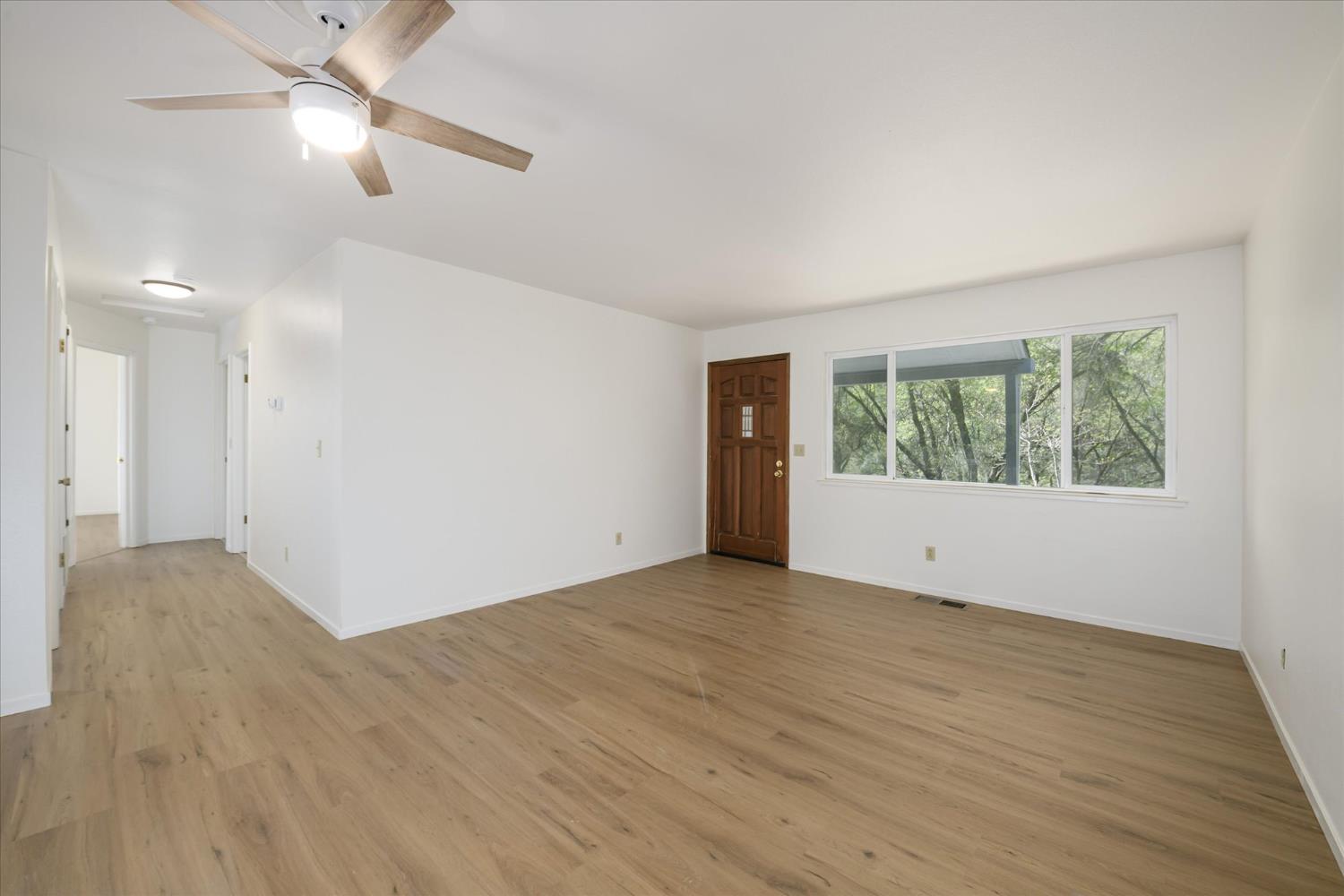 4910 Chisholm Trail Placerville, CA 95667 - Photo 4 of 41 wooden floor in an empty room with a window