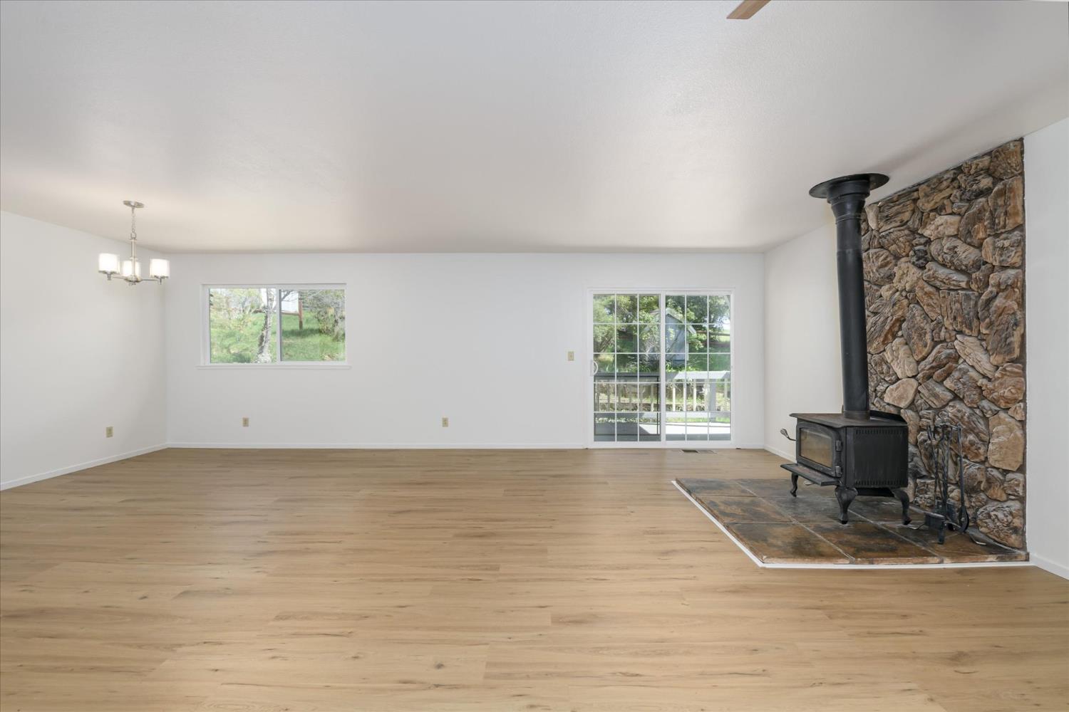4910 Chisholm Trail Placerville, CA 95667 - Photo 6 of 41 a view of a livingroom with wooden floor and a window