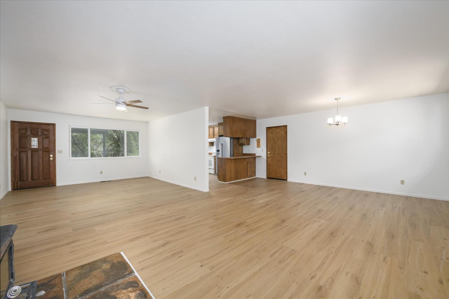 4910 Chisholm Trail Placerville, CA 95667 - Photo 7 of 41 an empty room with a kitchen and window
