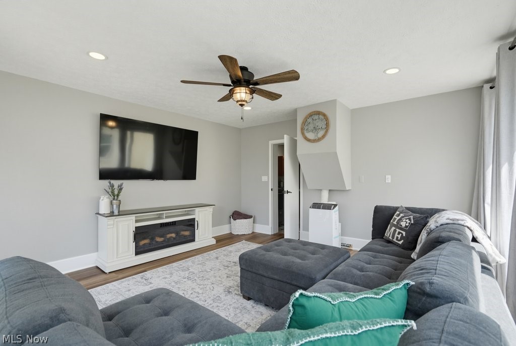 23055 Snell Road Columbia Station, OH 44028 - Photo 25 of 50 Living area featuring light gray walls, recessed lighting, and wood-finish flooring