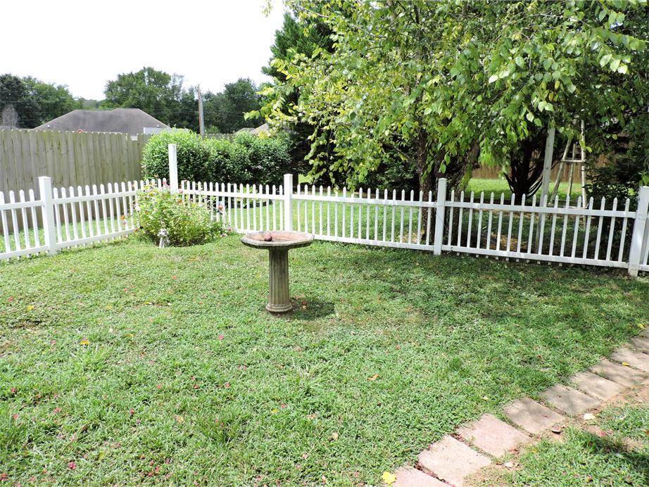 1020 Hummingbird Lane Spring Hill, TN 37174 - Photo 24 of 30 Back Yard Goes Just Past The Fencing To The Back Tree Line.