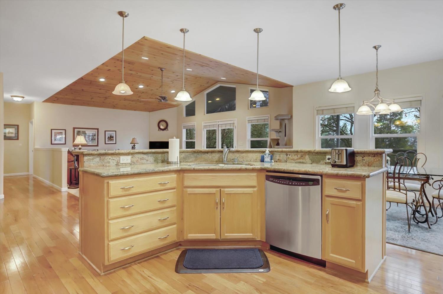 17036 Alice Way Grass Valley, CA 95949 - Photo 15 of 58 a kitchen with a sink and a refrigerator