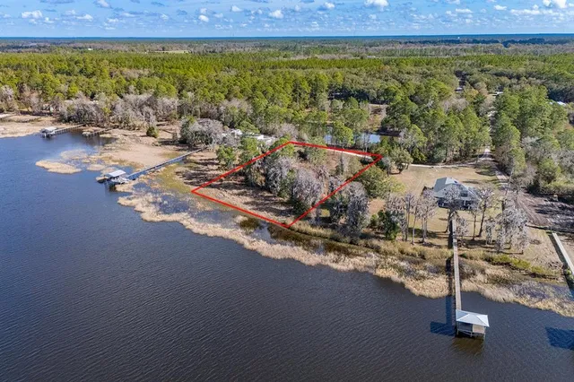 a view of a lake with a big yard