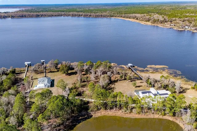 a aerial view of a house with a lake view