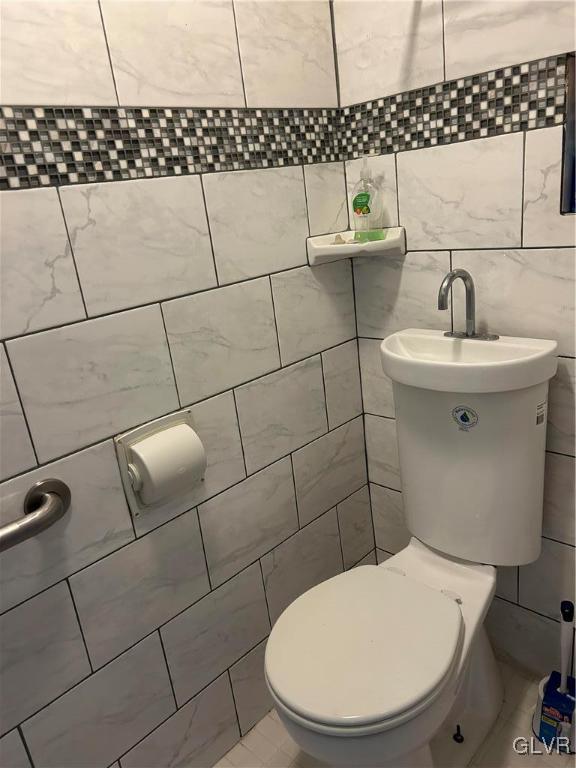 18 Repsher Road Bangor, PA 18013 - Photo 14 of 23 a white toilet sitting next to a bathroom sink