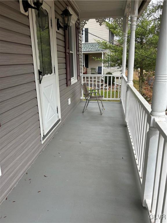 18 Repsher Road Bangor, PA 18013 - Photo 3 of 23 a view of a porch with wooden floor and outdoor seating