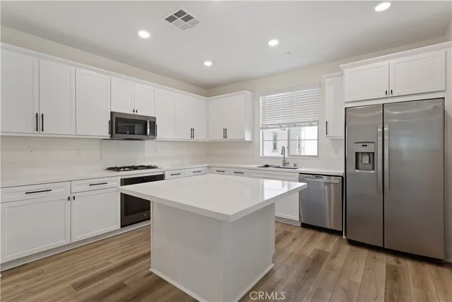 a kitchen with a stove and a sink