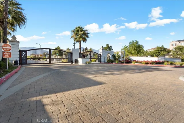 a view of a house with a plants and more windows