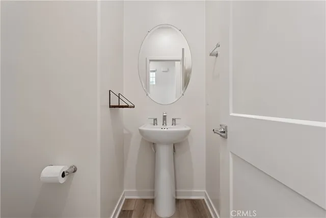 an empty room with windows and cabinet