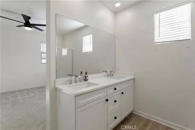 a bathroom with a shower curtain and a shower