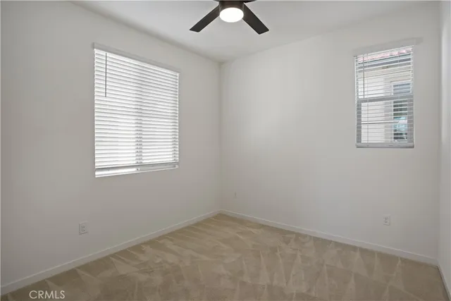 a car parked in front of a white building