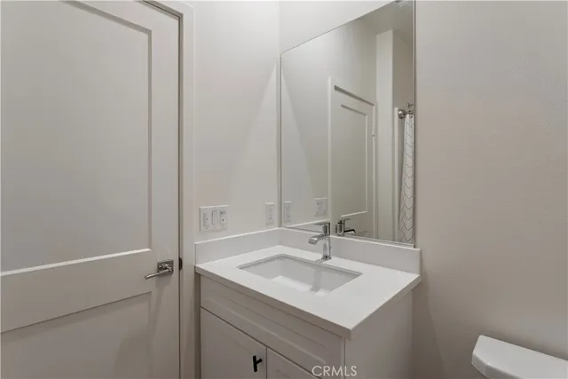 a open kitchen with a stove a table and chairs in it