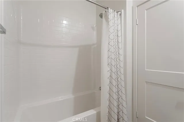 a livingroom with furniture a flat screen tv and a fireplace