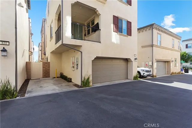 a view of a patio with table and chairs and potted plants