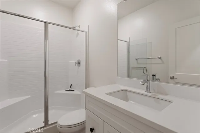 a kitchen with kitchen island a sink stove and refrigerator