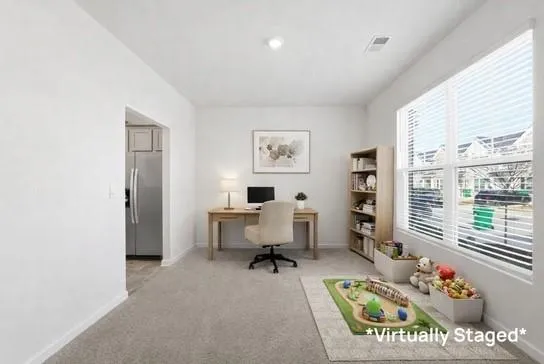 a workspace with furniture and window