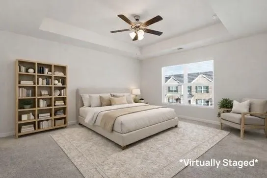 a spacious bedroom with a bed a couch and a window
