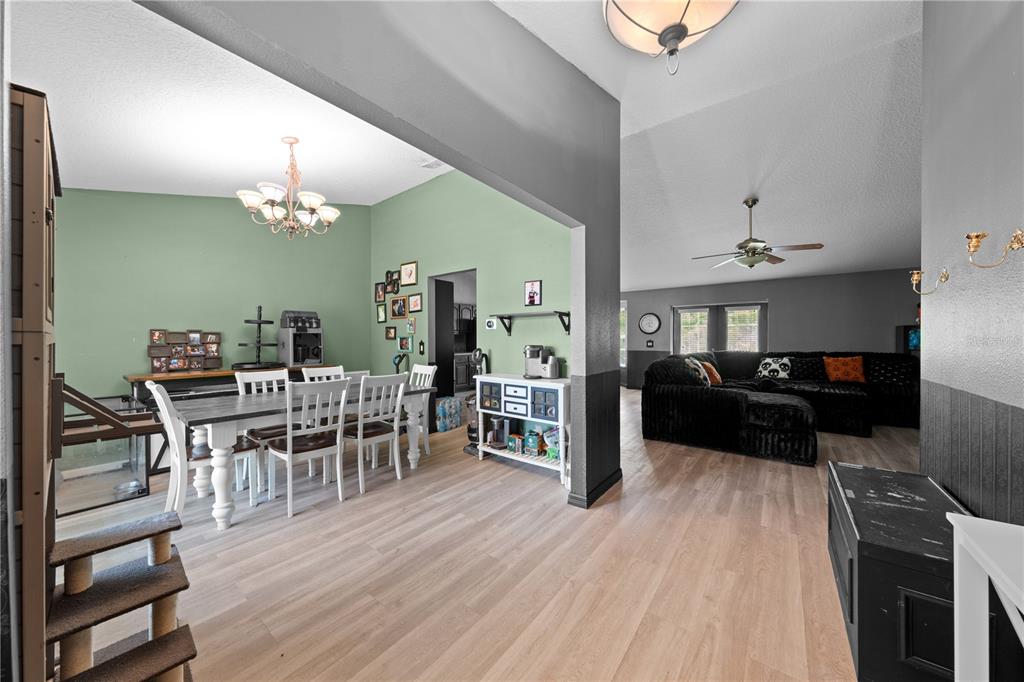 1965 Mustang Court St. Cloud, FL 34771 - Photo 6 of 33 a living room with furniture and a wooden floor