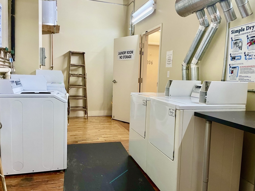 49 Munroe Street, Unit 201 Lynn, MA 01901 - Photo 13 of 14 a utility room with dryer and washer