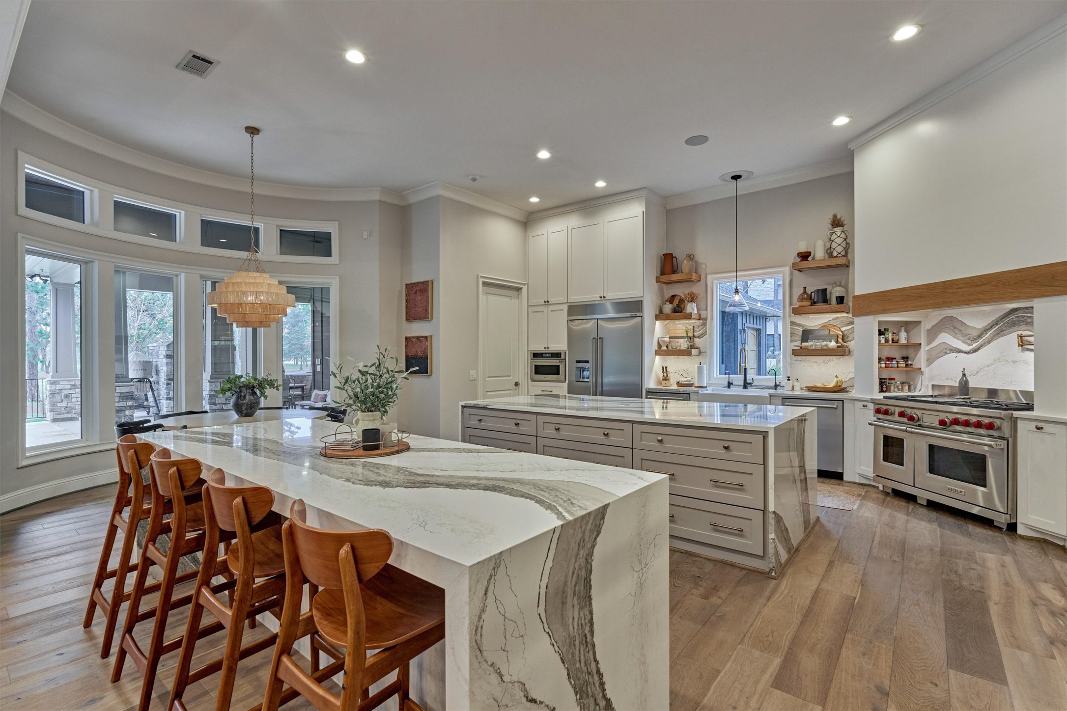 4463 Lily Bean Road Montgomery, TX 77316 - Photo 20 of 45 Soft close Shaker cabinetry, floating shelves, and double islands provide abundant storage.