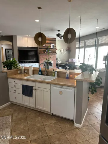 a kitchen with stainless steel appliances granite countertop a sink a stove and a microwave