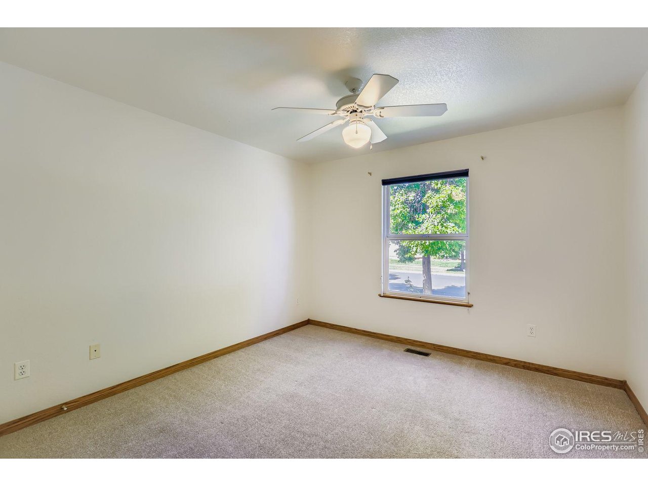 310 Bein Street Berthoud, CO 80513 - Photo 13 of 31 a view of an empty room with a window