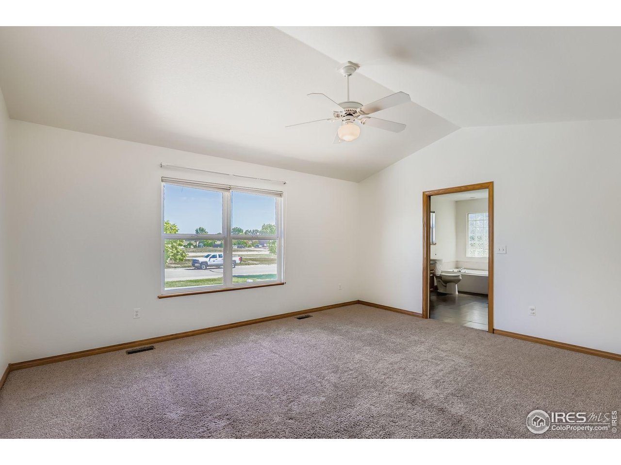 310 Bein Street Berthoud, CO 80513 - Photo 16 of 31 a view of an empty room with a window