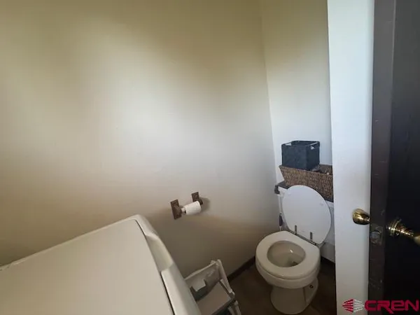 a bedroom with a bed and flat screen tv