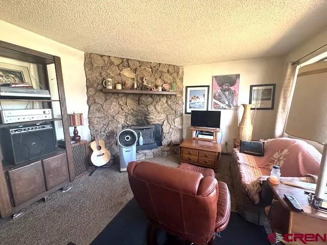a kitchen with sink refrigerator and window
