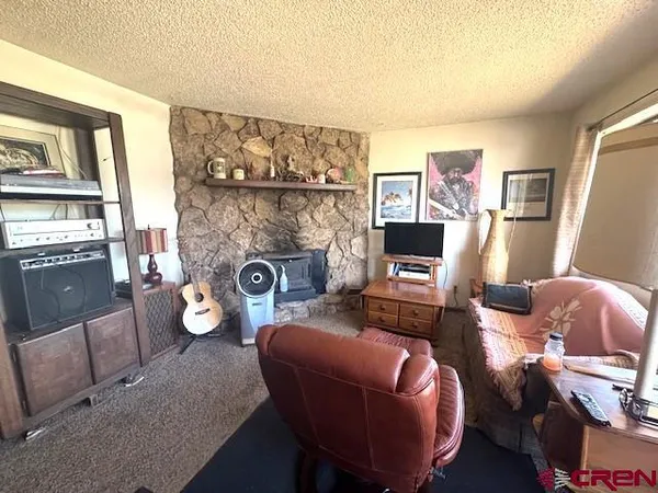 a kitchen with sink refrigerator and window