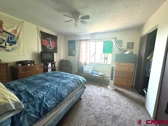 a room with a bed furniture and a window