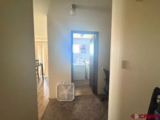 a bathroom with a sink and mirror with toilet